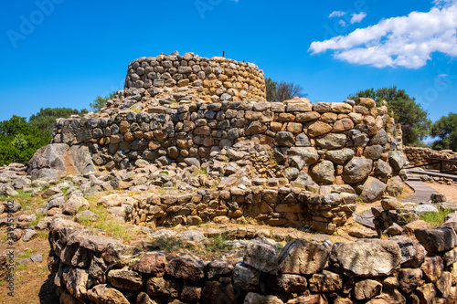 Arzachena, Sardinia, Italy - Archeological ruins of Nuragic complex La Prisgiona - Nuraghe La Prisgiona - with stone main tower and preserved remaining of Neolithic fortress