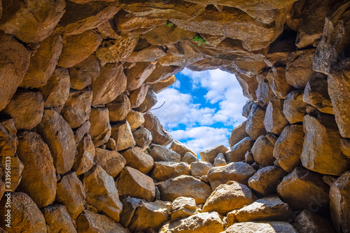 Arzachena, Sardinia, Italy - Archeological ruins of Nuragic complex La Prisgiona - Nuraghe La Prisgiona - with interior of stone tower of Neolithic fortress
