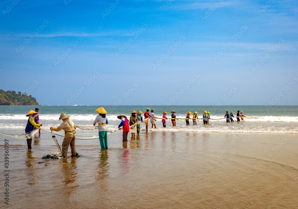 Traditional fishing on Pangandaran beach in Indonesia