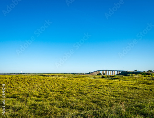 Bridge which seems to be alone on the green land