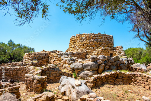 Arzachena, Sardinia, Italy - Archeological ruins of Nuragic complex La Prisgiona - Nuraghe La Prisgiona - with stone main tower and preserved remaining of Neolithic fortress
