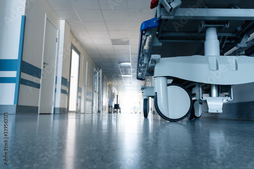 Medical bed on wheels in the hospital corridor.