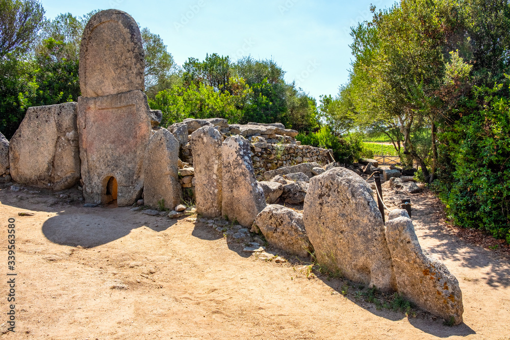 Arzachena, Sardinia, Italy - Archeological ruins of Nuragic necropolis Giants Tomb of Coddu Vecchiu  - Tomba di Giganti Coddu Vecchiu - with front grave stones of Neolithic cemetery