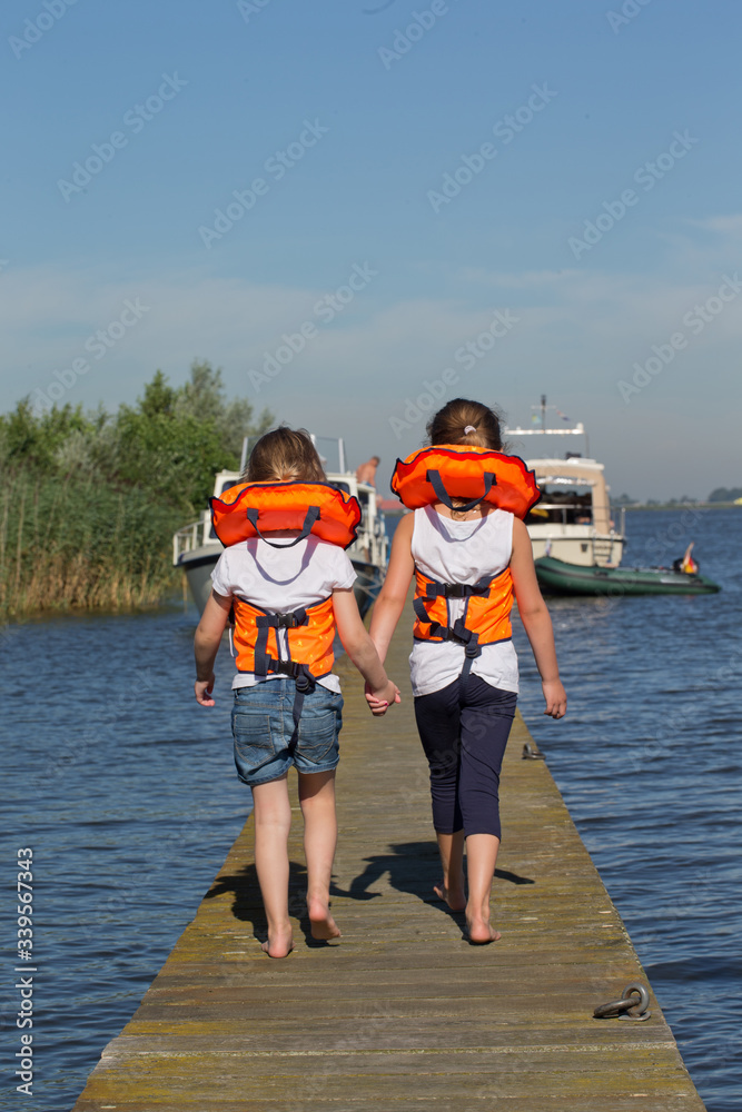 Children wearing life jacket. Safety. Boating Children wearing life jacket. Safety. Boating
