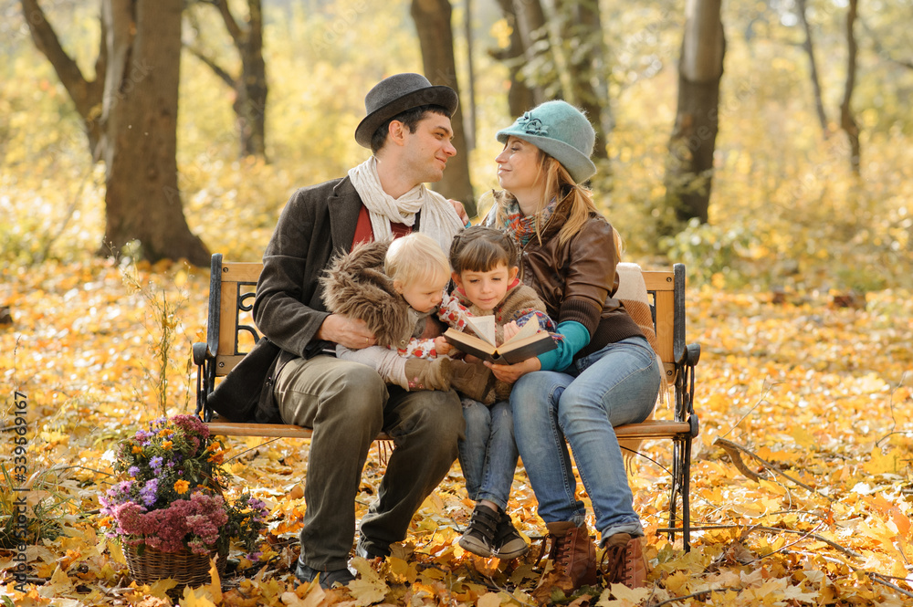 A family with two daughters went on a picnic. Autumn time. A family with two daughters went on a picnic. Autumn time.