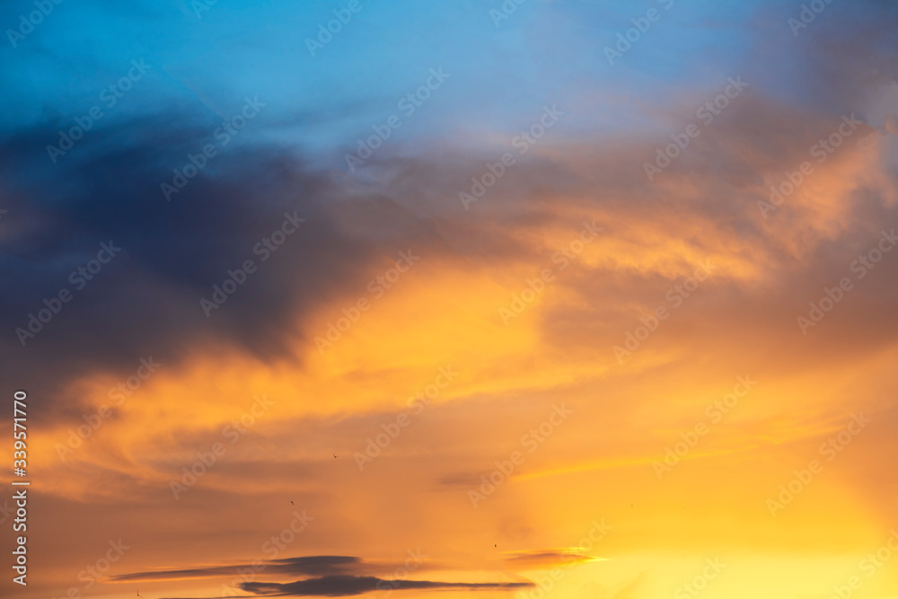 Beautiful sunset sky. Dramatic colorful clouds after sunset. Nature backgrounds.	