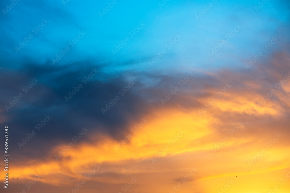 Beautiful sunset sky. Dramatic colorful clouds after sunset. Nature backgrounds.	