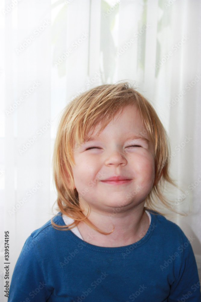Girl smiles with her eyes closed Girl smiles with her eyes closed