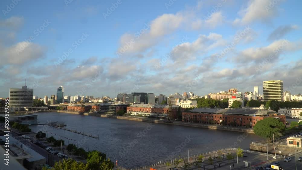 Aerial view of beautiful modern buildings skyline in sunny summer day with blue sky in Puerto Madero, downtown Buenos Aires, Argentina. Modern architecture of office skyscraper and city apartments. 4K Aerial view of beautiful modern buildings skyline in sunny summer day with blue sky in Puerto Madero, downtown Buenos Aires, Argentina. Modern architecture of office skyscraper and city apartments. 4K