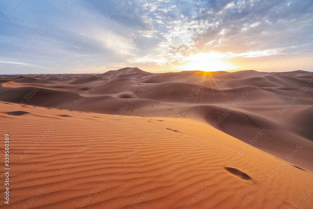 Beautiful sunset over sand dunes of Sahara Desert, Africa Beautiful sunset over sand dunes of Sahara Desert, Africa
