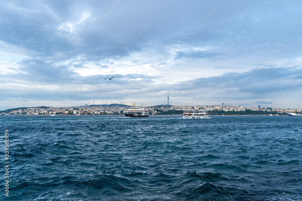 Ferries crossing The Bosphorus Strait in Istanbul, Turkey. July, 2019