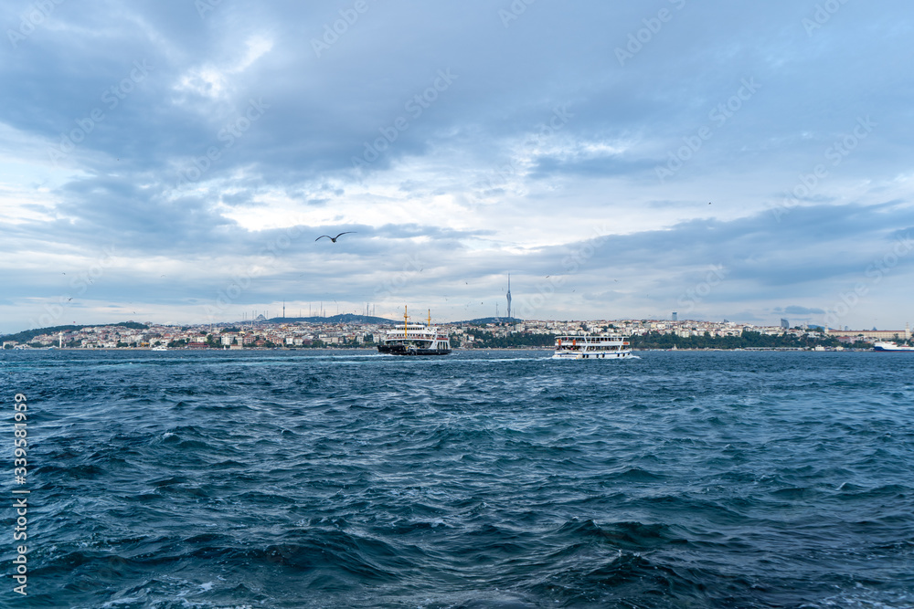 Ferries crossing The Bosphorus Strait in Istanbul, Turkey. July, 2019 Ferries crossing The Bosphorus Strait in Istanbul, Turkey. July, 2019