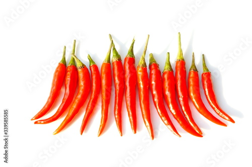 In the photo, red chili peppers. Pods on a white background.