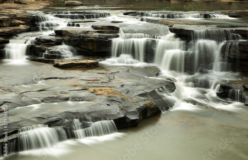 Multiple sheets if water falling in Lakhaniya Dari Water Fall photo