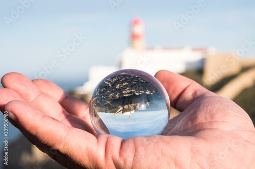 View of the lighthouse through crystal globe at Cape St. Vincent.