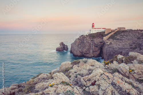 View of the lighthouse and cliffs at Cape St. Vincent at sunset. Continental Europe's most South-western point, Sagres, Algarve, Portugal.