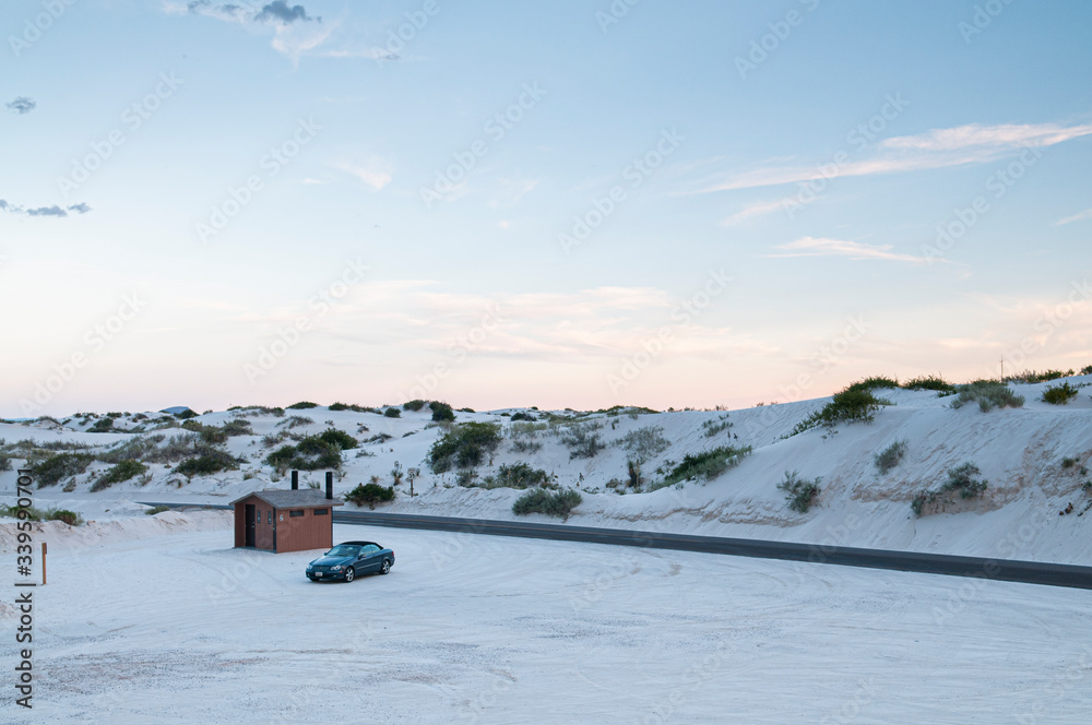 car parked in the white sand desert