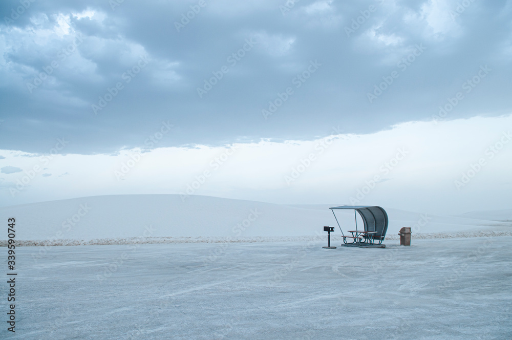 picnic area in the middle of the white sand desert in cloudy day