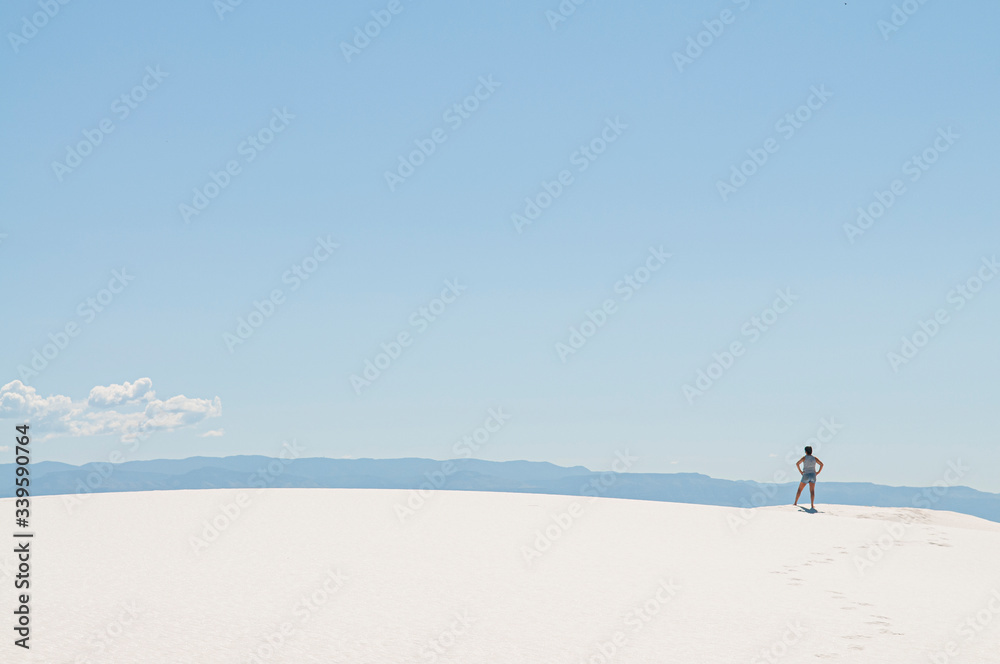 a person in the white sand desert