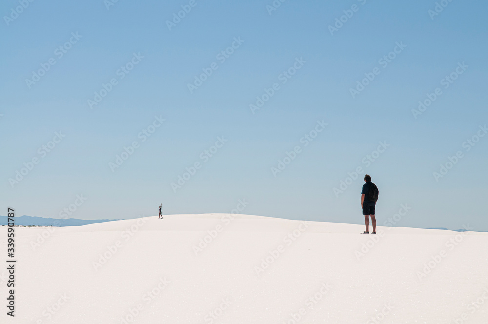 a person in the white sand desert