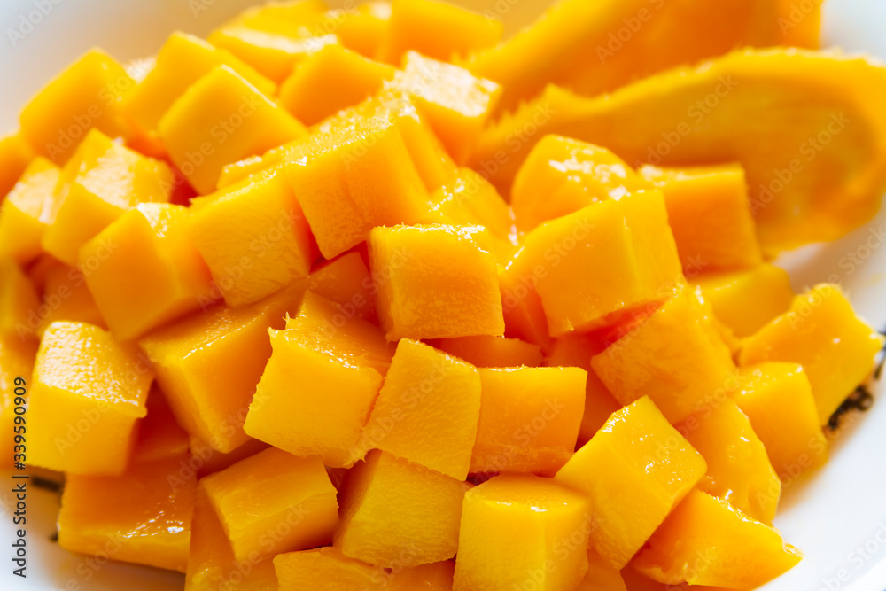 Mango cube fruit salad in a bowl close up