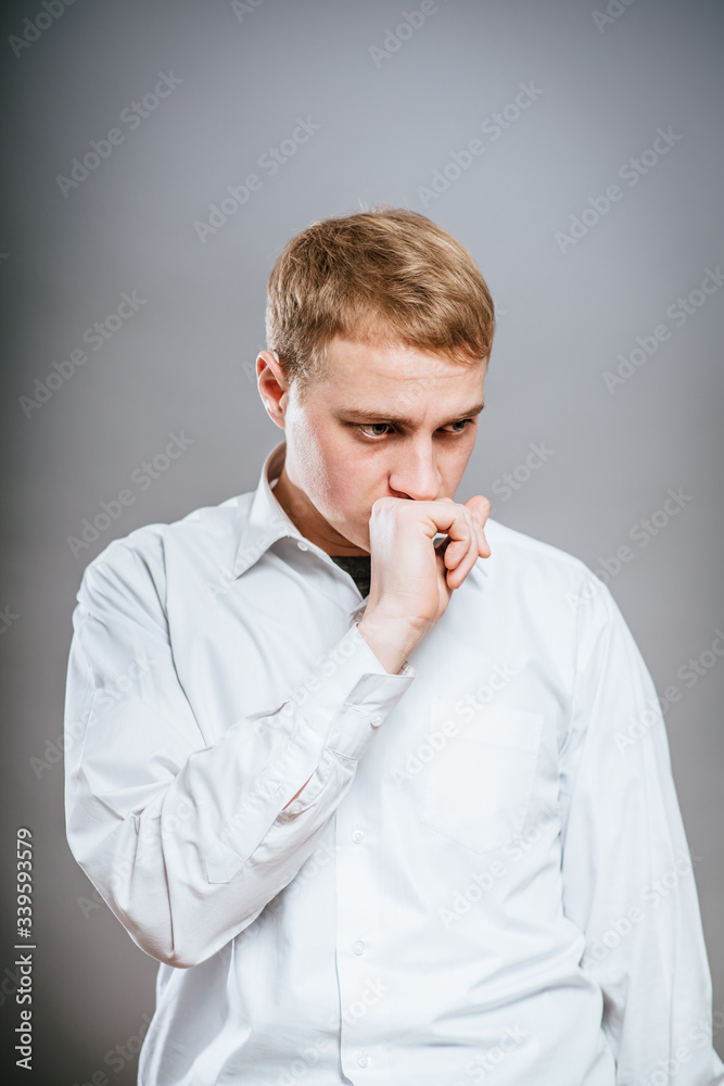 Puzzled handsome young man scratching his head with his hand as he looks at the camera with an uncertain perturbed expression, isolated on white Puzzled handsome young man scratching his head with his hand as he looks at the camera with an uncertain perturbed expression, isolated on white