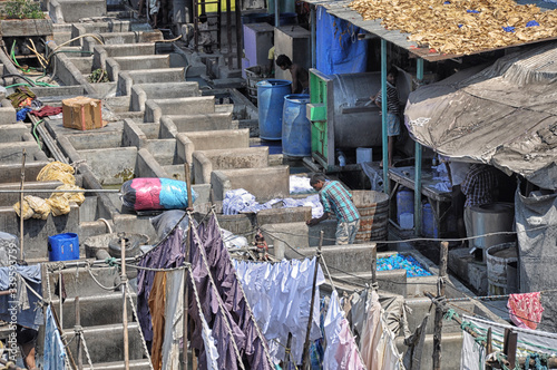 Mumbai, India-March 03,2013: Laundry Dhobi Ghat in Mumbai, people wash clothes on a city street. India's biggest wash. photo