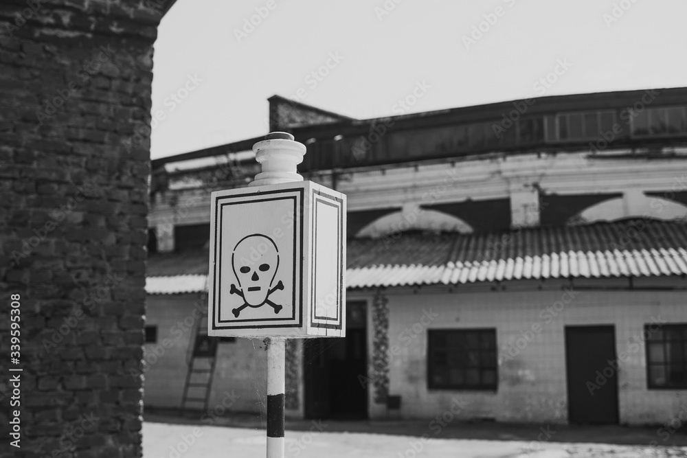 Fototapeta premium Black and white photography of abandoned empty building and death street sign.