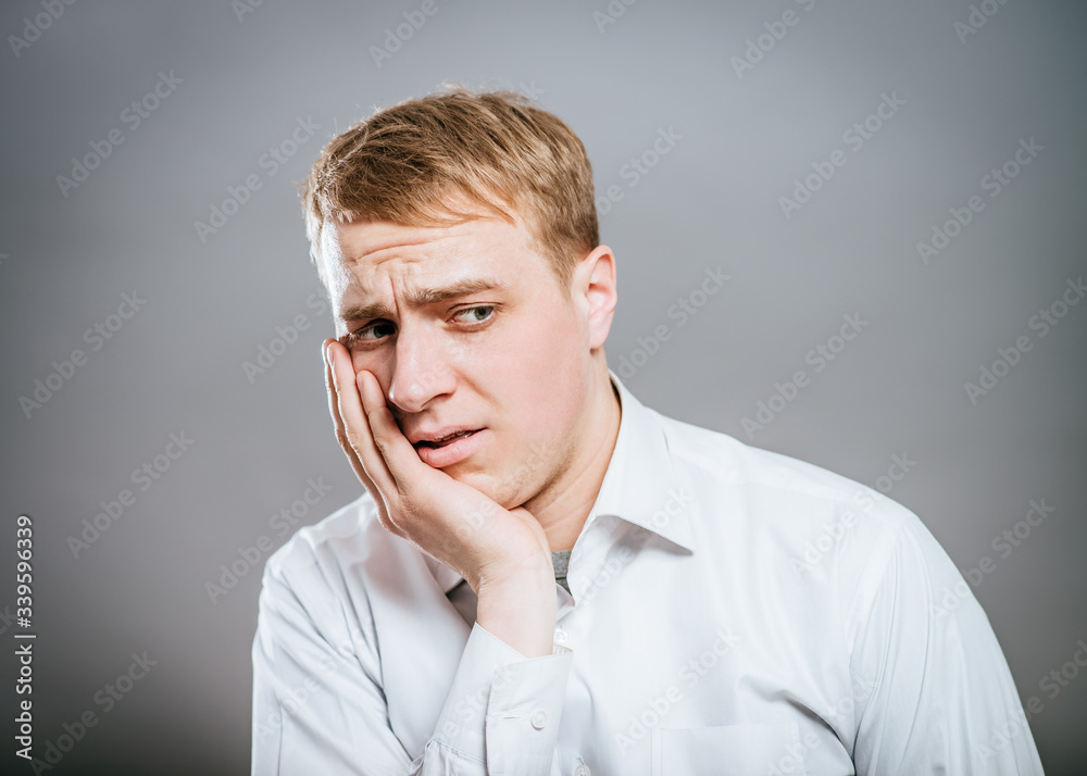 portrait of mature business man with hand on chin, looking at camera. head and shoulders, front view, copy space portrait of mature business man with hand on chin, looking at camera. head and shoulders, front view, copy space