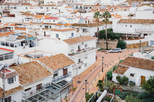 A town in the south of Spain with small white houses and narrow streets. Quarantine in Europe due to the epidemic Covid-19, deserted streets, view from above. photo