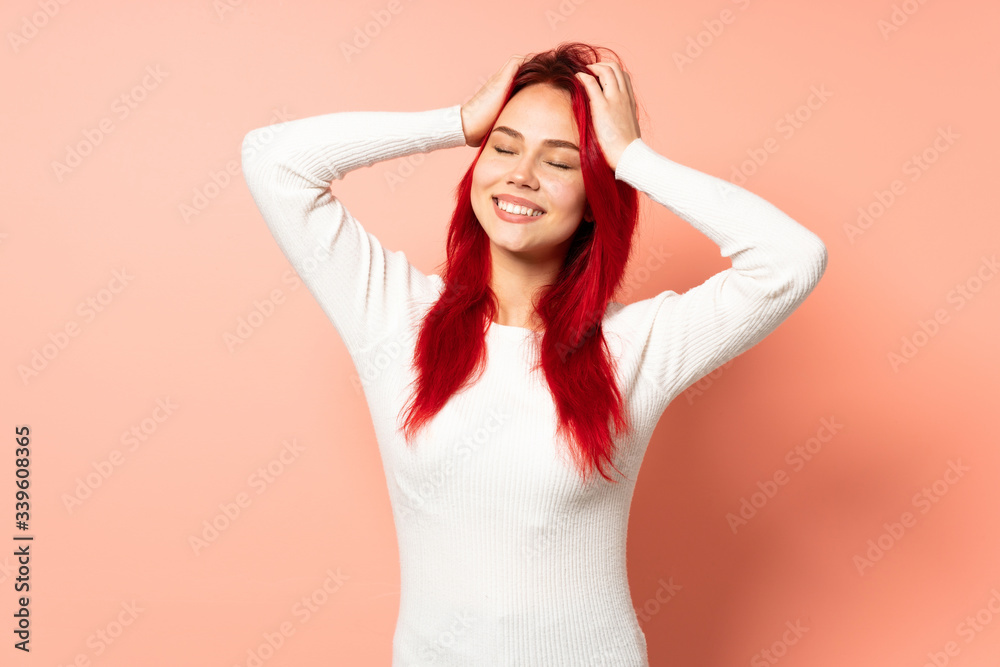 Teenager red hair girl isolated on pink background laughing Teenager red hair girl isolated on pink background laughing