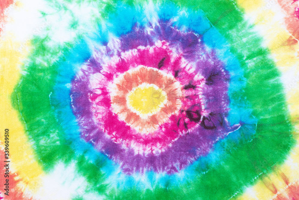 tie dye pattern hand dyed on cotton fabric abstract texture background. tie dye pattern hand dyed on cotton fabric abstract texture background.