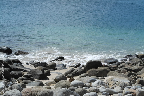 beautiful Pebble beach, gray stones, blue sea. background