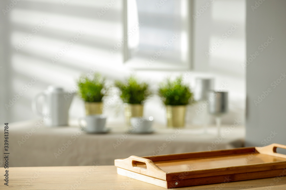 Fototapeta premium Mineral water on a wooden table in the morning sunlight with free space for an advertising product