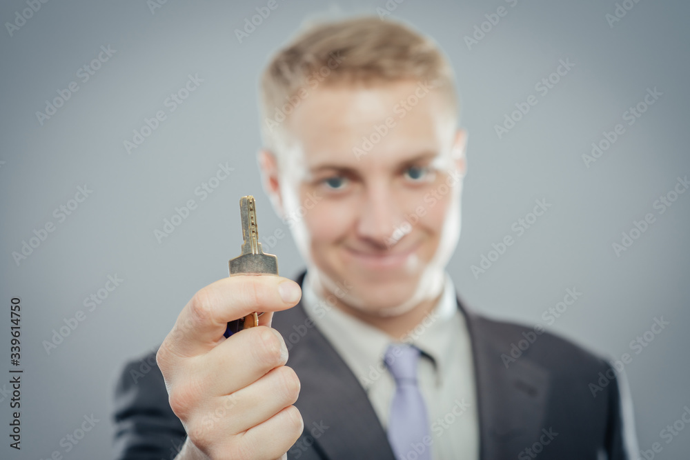 man businessman realtor offering keys studio isolated man businessman realtor offering keys studio isolated