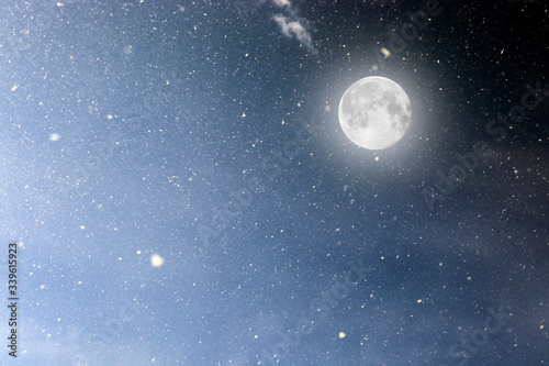 Photo of the cosmic sky with luminous stars and a large moon. Background. Texture of the starry sky. Space. A supermoon. Full moon. Observation of the cosmos.