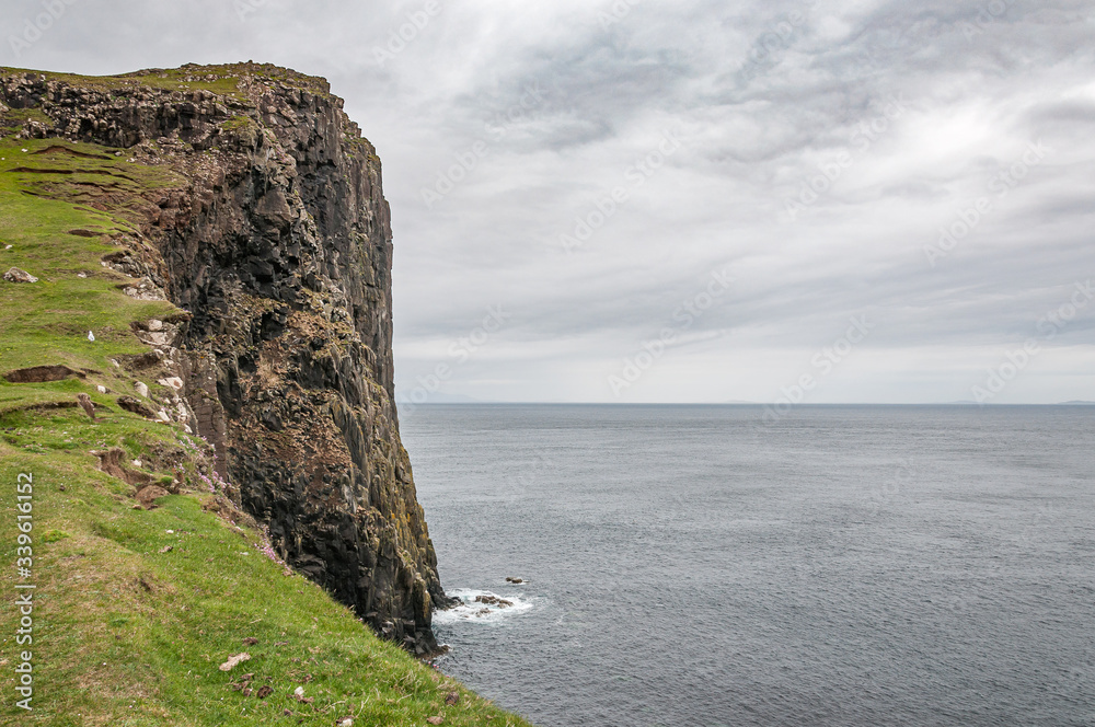 Cliffs overlooking the sea in the Isle of Skye. Concept: travel in Scotland, typical Scottish landscapes, places of charm and mystery
