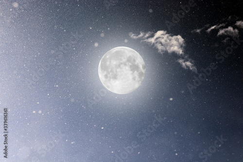 Photo of the cosmic sky with luminous stars and a large moon. Background. Texture of the starry sky. Space. A supermoon. Full moon. Observation of the cosmos.