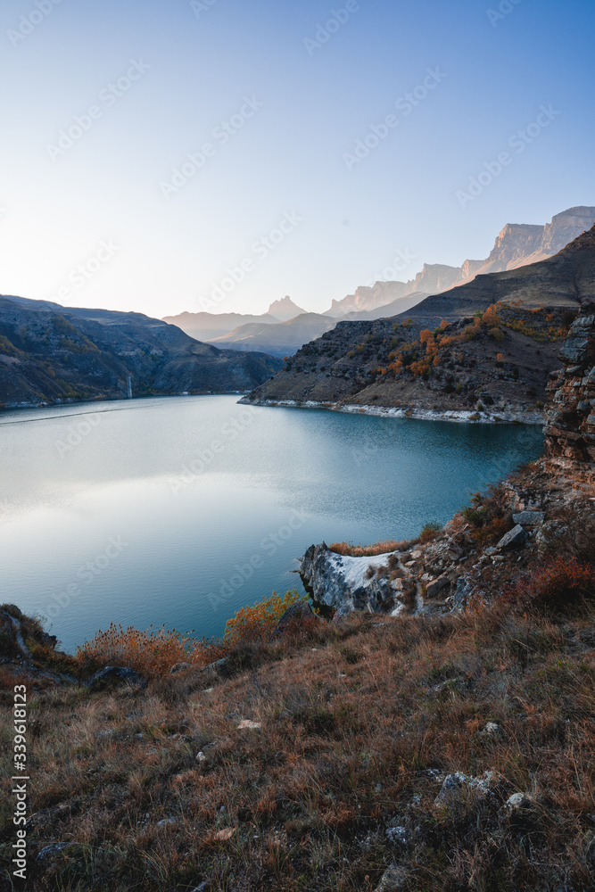 Naklejka premium mountain lake at sunset