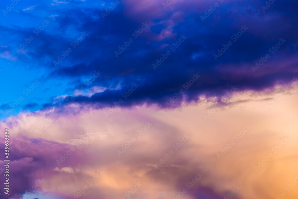 Multi-colored thundercloud at sunset. Beautiful sky