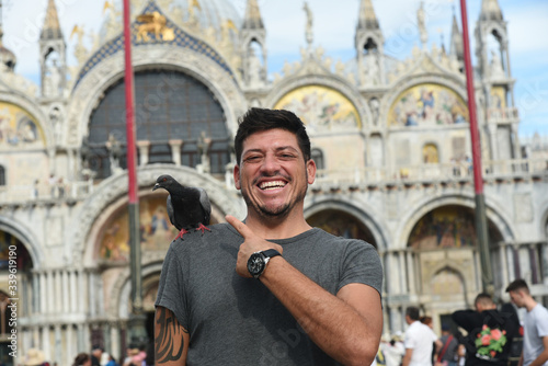 Laughing man with a bird on his shoulder - Venice