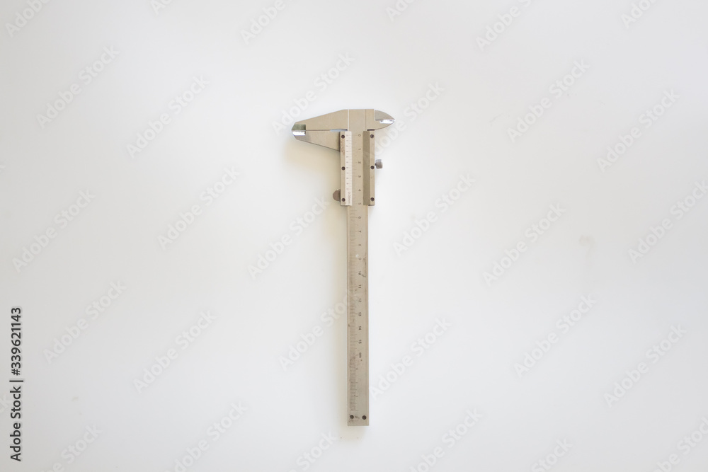 vernier caliper on white background. Card with copy space for text. Top view, flatlay. vernier caliper on white background. Card with copy space for text. Top view, flatlay.