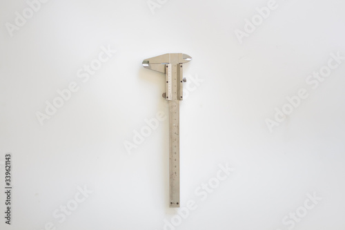 vernier caliper on white background. Card with copy space for text. Top view, flatlay.
