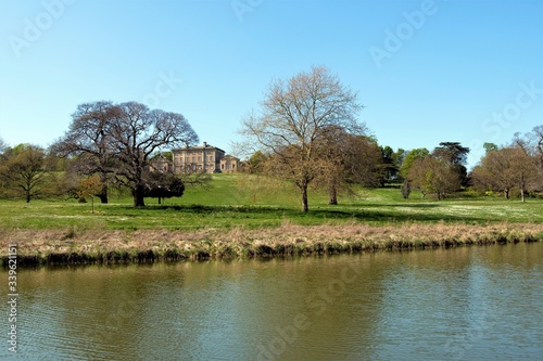 Landscape with trees and river at Cuswoth Hall, Doncaster, South Yorkshire, England. photo