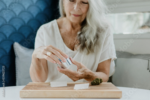 Mature woman with cannabis photo