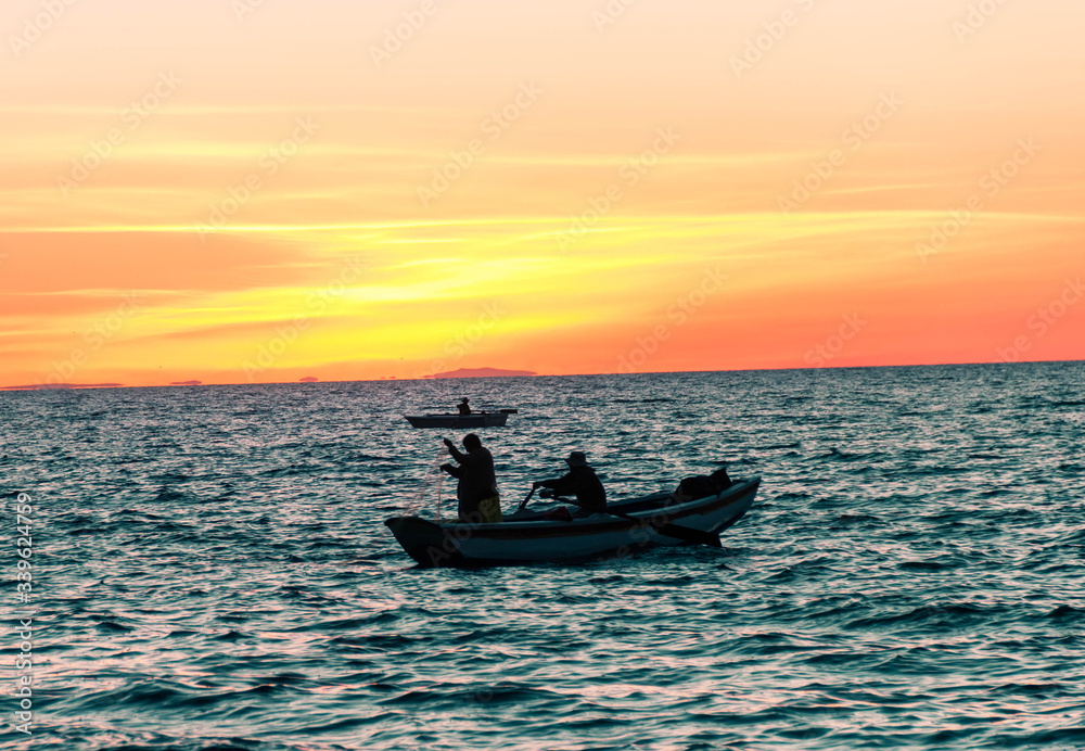 fishing in the sunset Titicaca Bolivia
