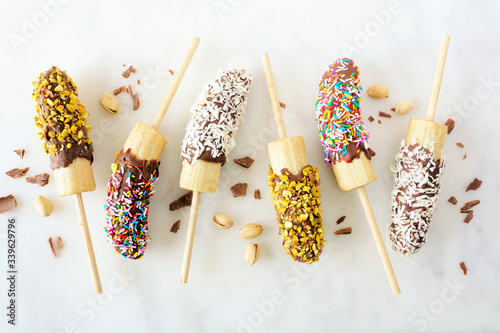 Εκτύπωση καμβά Frozen chocolate dipped banana pops with nuts, sprinkles and coconut