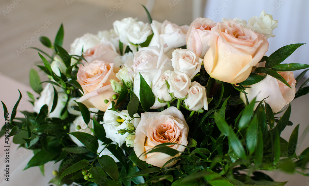 Table for wedding with white ang light pink flowers  in restaraunt 