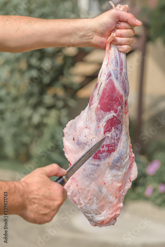 The process of cutting meat for the celebration of Eid al-Adha. Muslim sacrifice