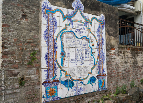 Tile map of Colonia del Sacramento on the old wall, Uruguay. March 2020